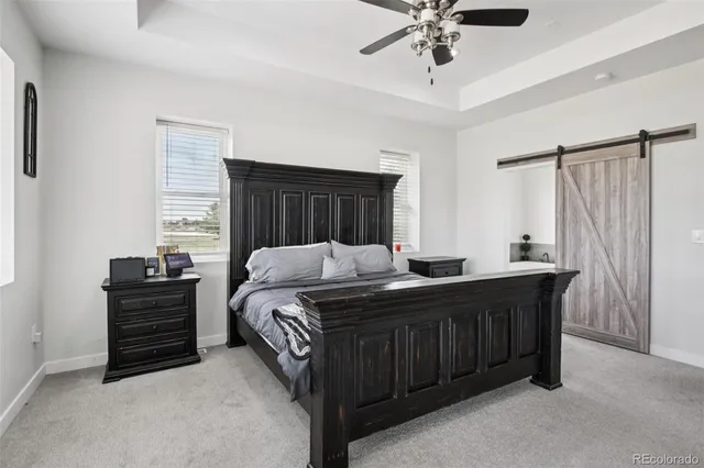 a bedroom with a bed dresser and a window