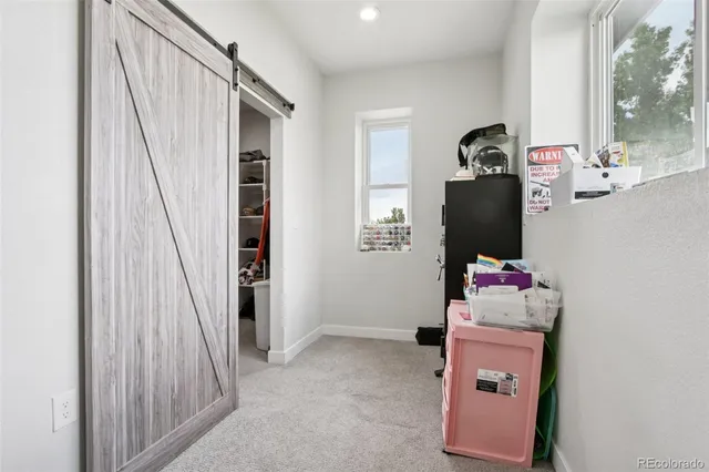 a workspace with furniture and window