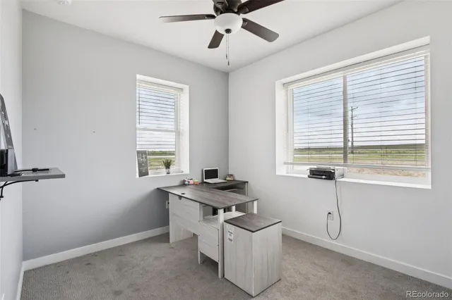 a bathroom with double vanity sink a mirror and a toilet