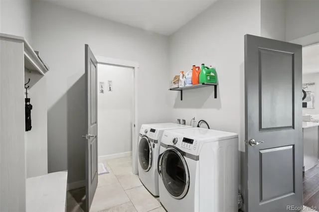 a dining room with furniture and a large window