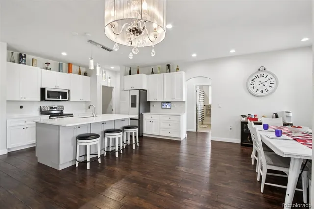 a view of kitchen with cabinets and wooden floor