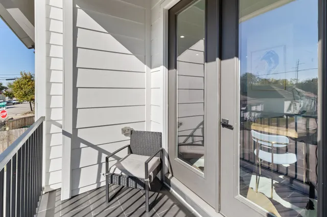 a balcony view with a potted plant on a table