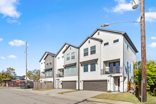 a view of a white building among the street