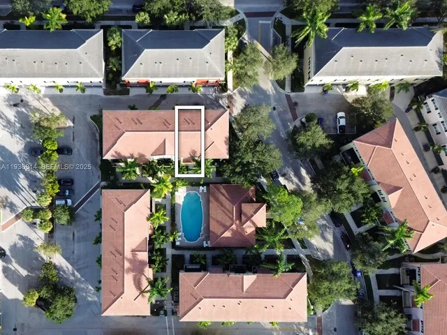 an aerial view of houses with yard