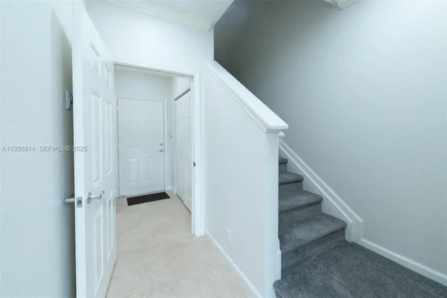 a view of hallway with stairs