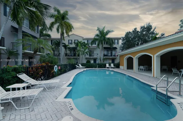 an aerial view of lake residential houses with outdoor space and seating