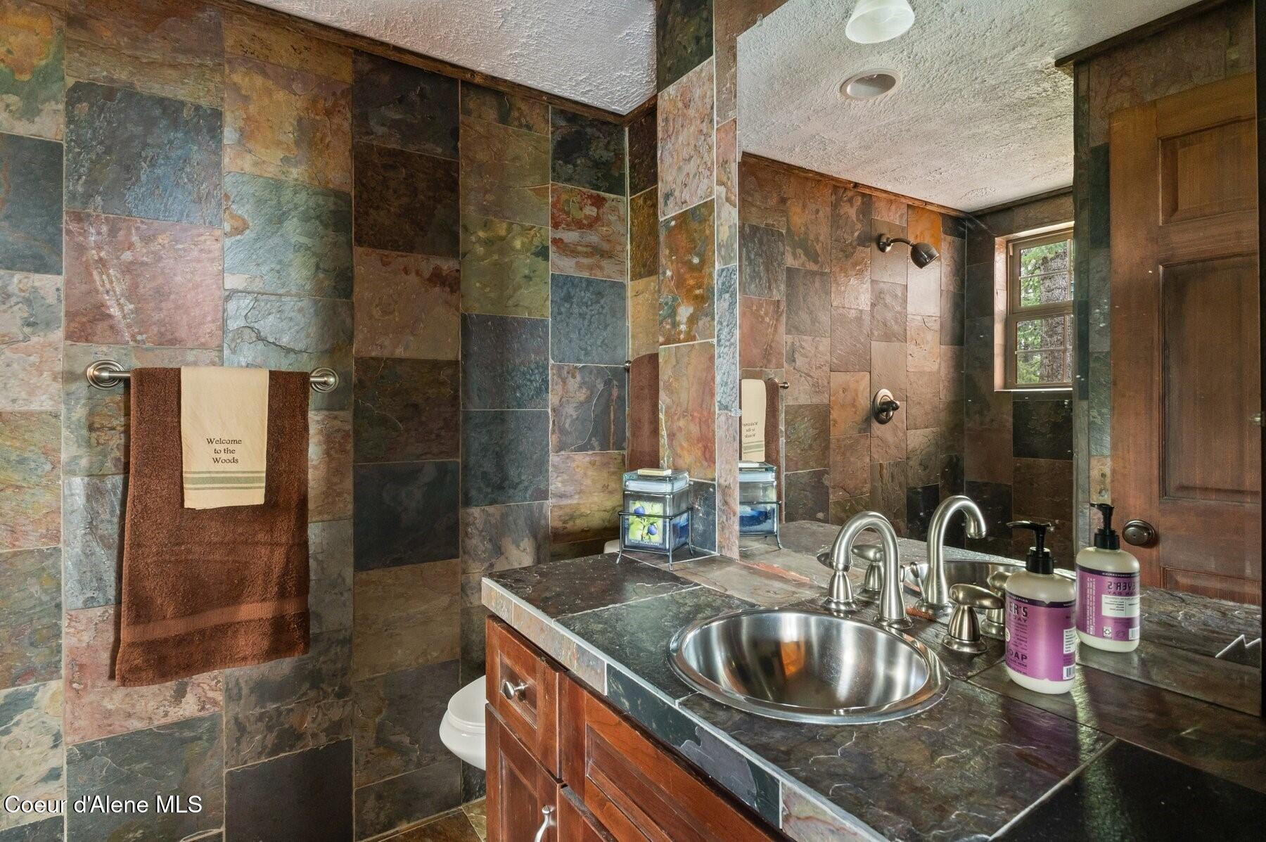 1298 Raven Ridge Road Sandpoint, ID 83864 - Photo 11 of 60 Main Level Bathroom