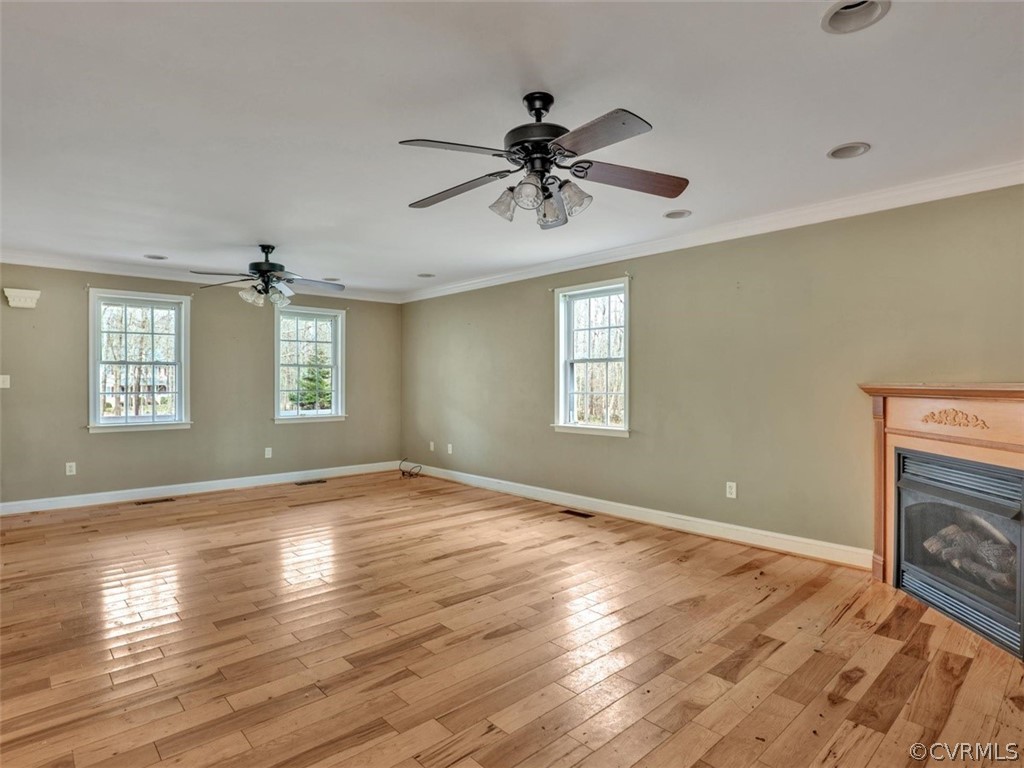22157 Rowanty Road Carson, VA 23830 - Photo 6 of 34 a view of empty room with wooden floor and fan