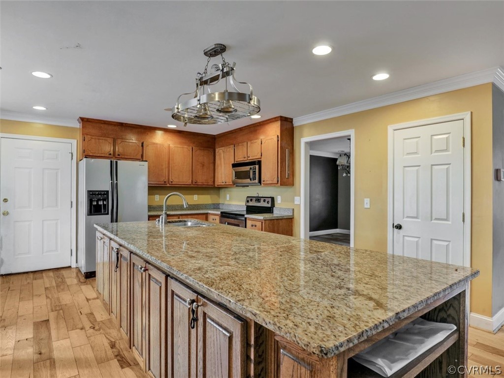 22157 Rowanty Road Carson, VA 23830 - Photo 7 of 34 a kitchen with stainless steel appliances granite countertop a sink refrigerator and cabinets