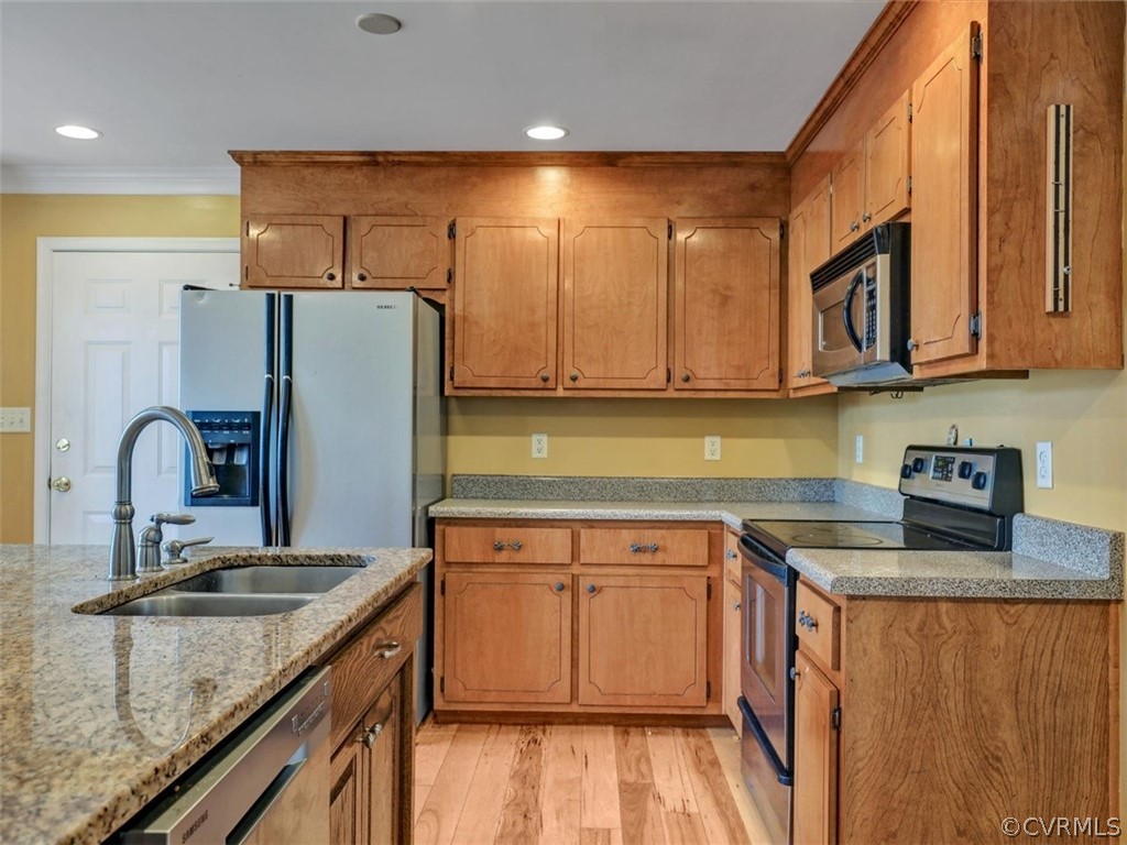 22157 Rowanty Road Carson, VA 23830 - Photo 9 of 34 a kitchen with stainless steel appliances granite countertop a sink stove and refrigerator