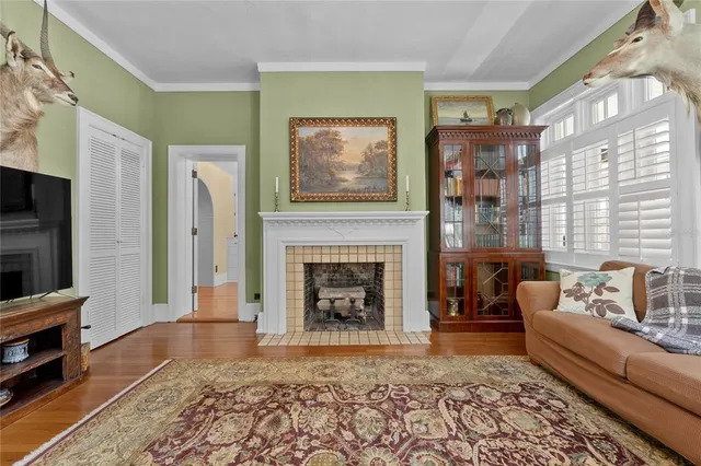 a kitchen with a stove cabinets and wooden floor