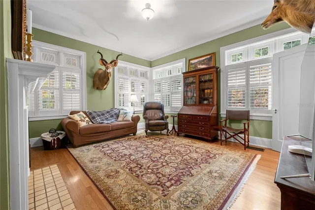 a view of a dining room with furniture window and wooden floor
