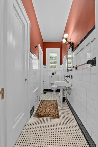 a view of a balcony with floor to ceiling window and wooden fence