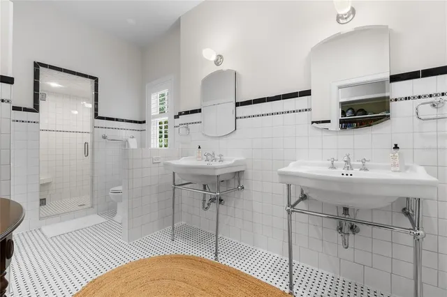 a bathroom with a sink toilet and mirror