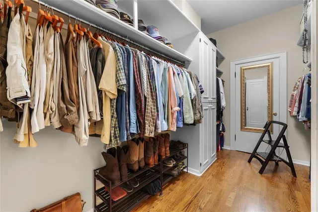 a front view of a house with a garden and plants