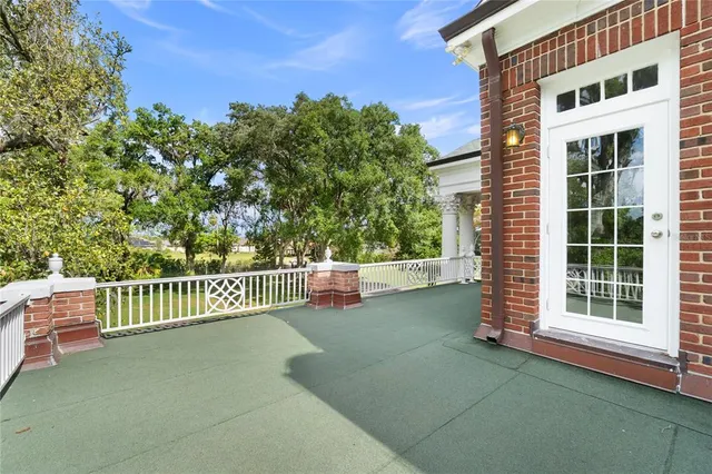 a view of yard with swimming pool and green space
