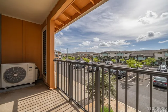 a view of a balcony with furniture