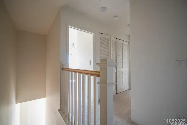 a view of a hallway with entryway door