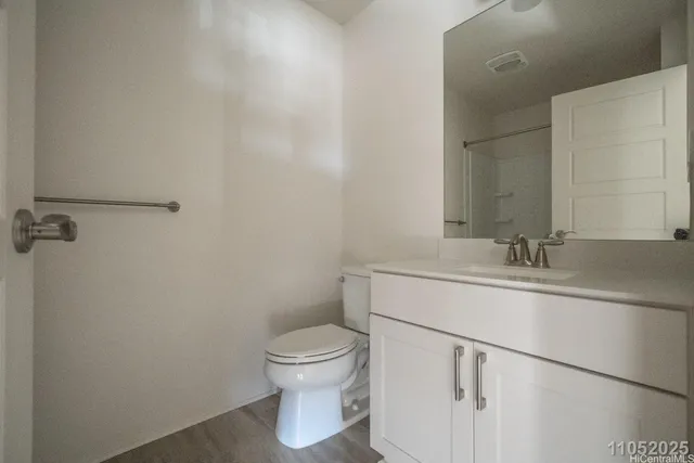 a bathroom with a sink toilet and vanity