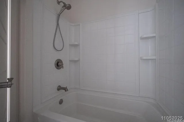 a bathroom with a bath tub and a shower