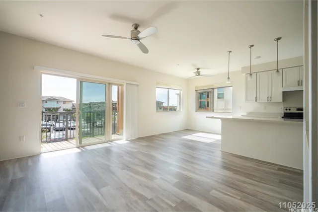 a view of large kitchen with wooden floor and outdoor space