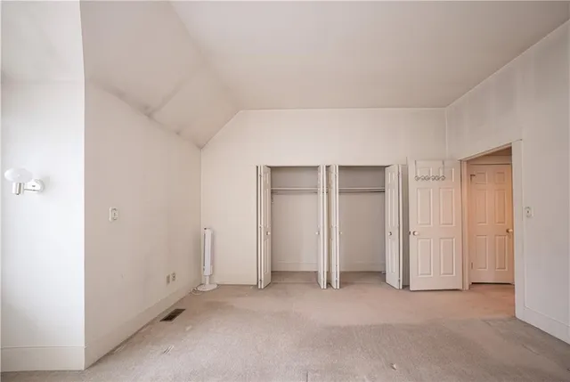an empty room with closet area