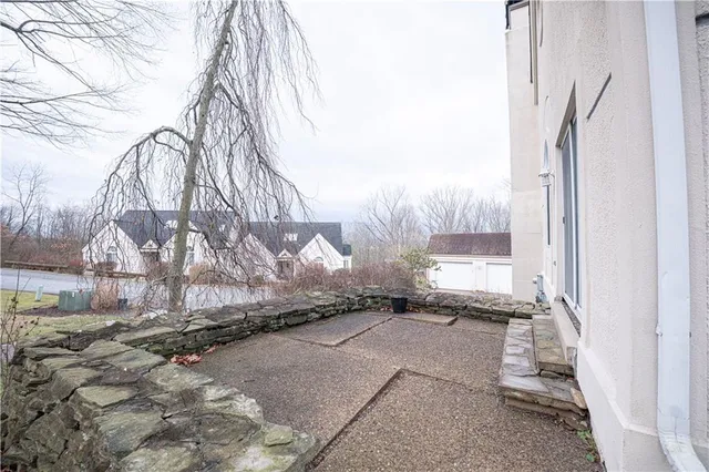 a view of a backyard of the house