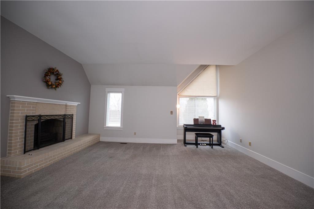 15 Ridgemead Fields Drive Plum, PA 15147 - Photo 5 of 32 a view of a livingroom with furniture and a fireplace