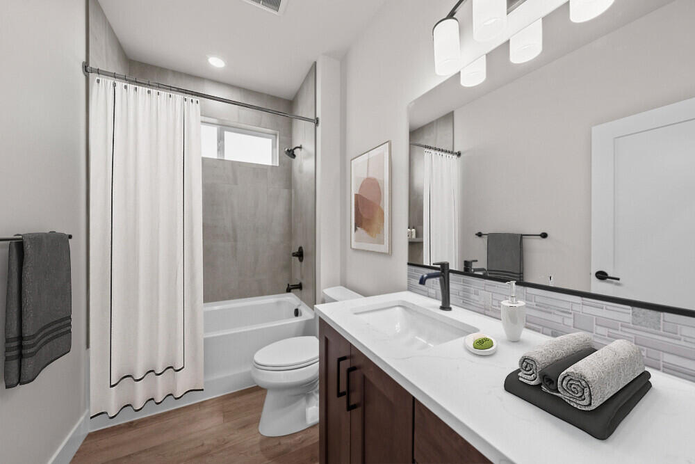 3735 Northeast Suchy St Bend Bend, OR 97701 - Photo 8 of 21 a bathroom with a granite countertop sink a toilet a mirror and shower