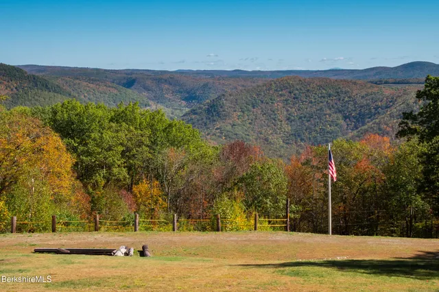 a view of a swimming pool with an ocean view