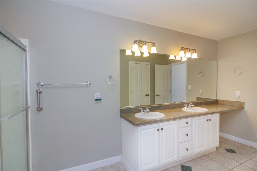 735 Britton Street Anderson, SC 29621 - Photo 29 of 50 This bathroom features a double vanity and sleek shower, offering a modern and functional space.