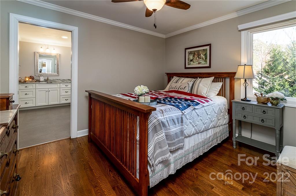 3802 Gordon Street Terrell, NC 28682 - Photo 28 of 48 a bedroom with a bed and a mirror on the dresser