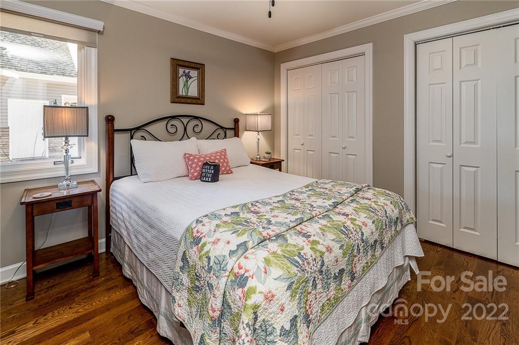 3802 Gordon Street Terrell, NC 28682 - Photo 31 of 48 a bedroom with a bed and a lamp on dresser