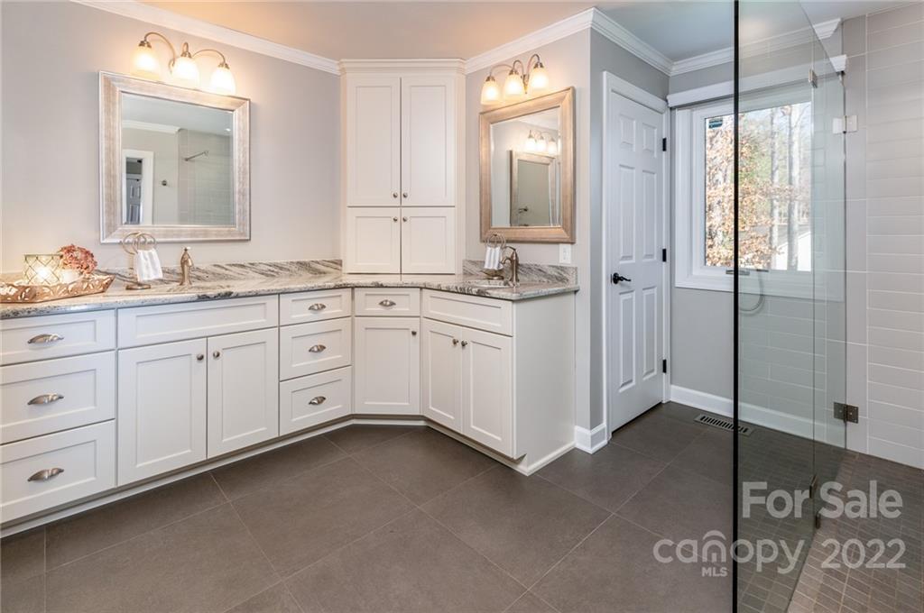 3802 Gordon Street Terrell, NC 28682 - Photo 35 of 48 a spacious bathroom with a granite countertop sink mirror and a