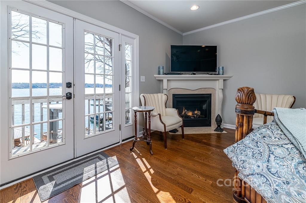 3802 Gordon Street Terrell, NC 28682 - Photo 37 of 48 a living room with furniture a fireplace and a flat screen tv