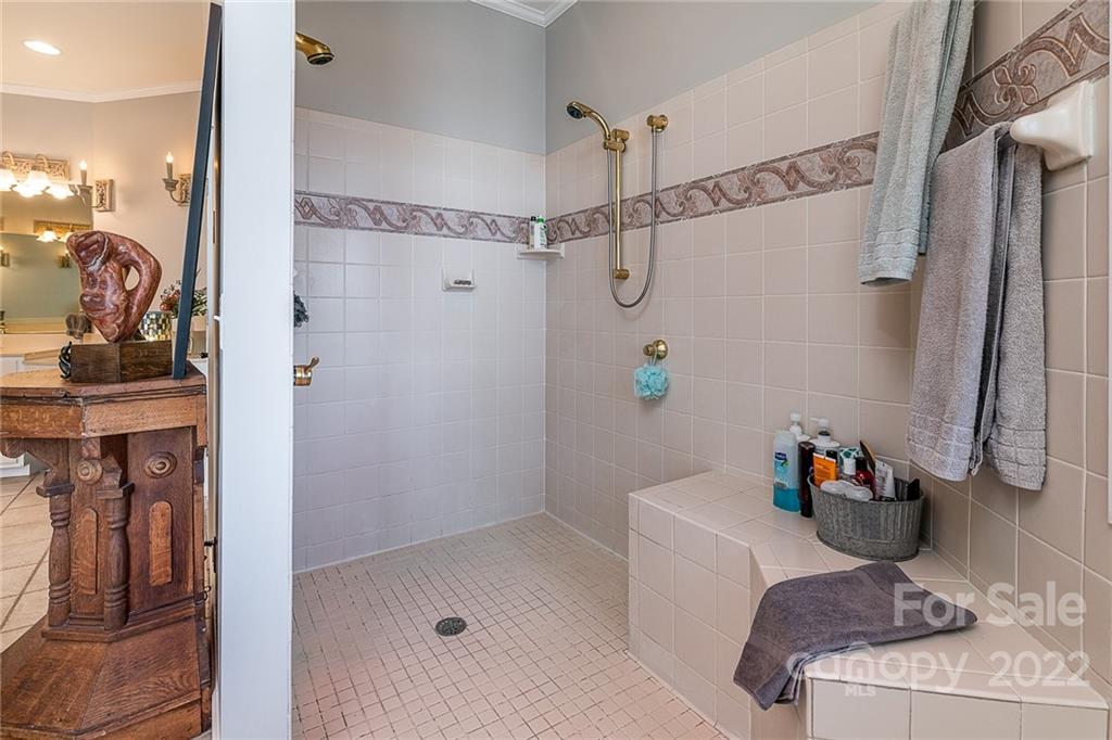 3802 Gordon Street Terrell, NC 28682 - Photo 40 of 48 a bathroom with a tub shower and sink