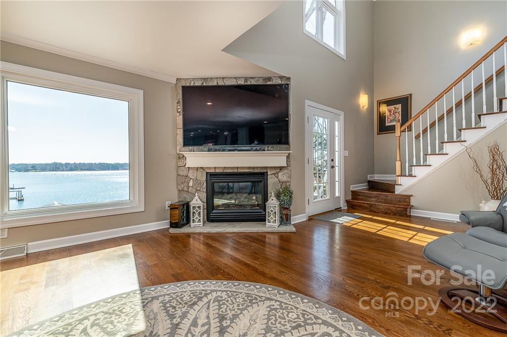 3802 Gordon Street Terrell, NC 28682 - Photo 10 of 48 a living room with fireplace and a flat screen tv