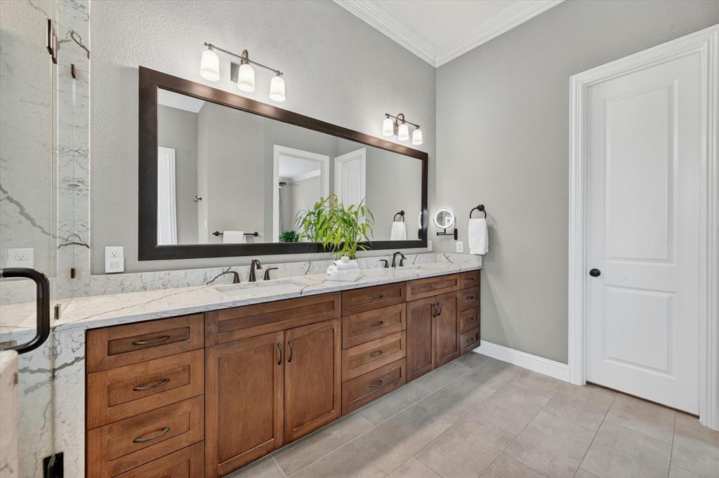6656 Roughleaf Ridge Road Flower Mound, TX 76226 - Photo 21 of 40 a bathroom with a granite countertop sink double and mirror