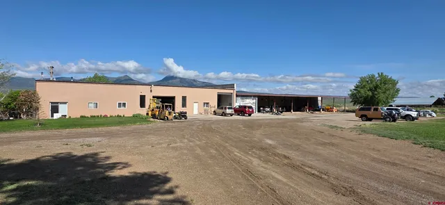 a front view of a house with a street