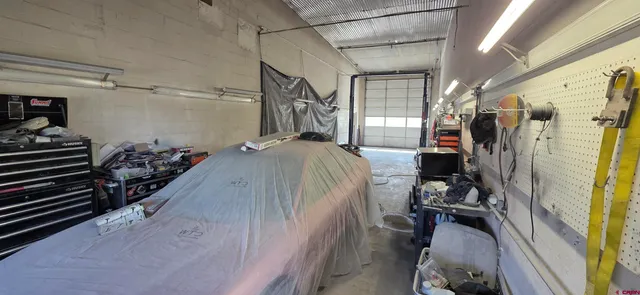 a view of a closet with storage and utility room