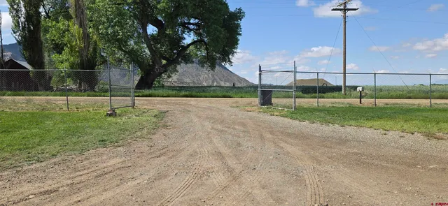 a view of ocean with green space