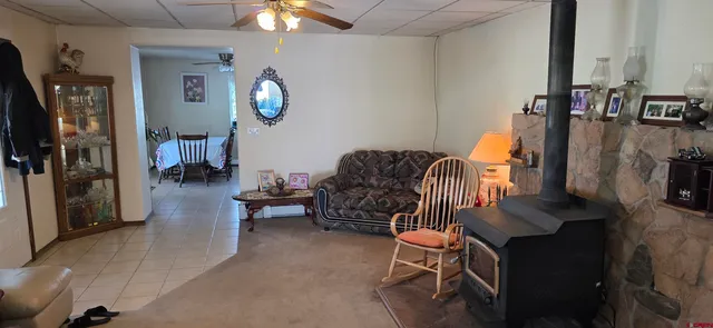 a living room with furniture a lamp and a chandelier