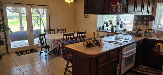 a view of a dining room with furniture and a window