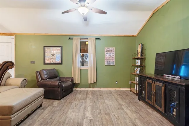 a open kitchen with stove a sink dishwasher a refrigerator and wooden floor