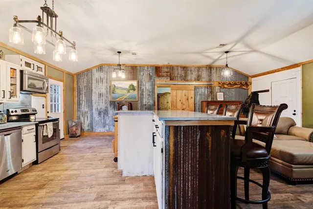 a bedroom with a bed and large mirror