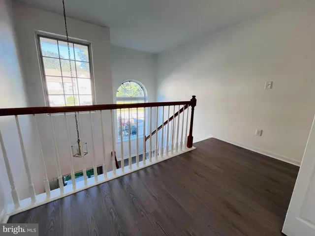 a view of staircase with wooden floor