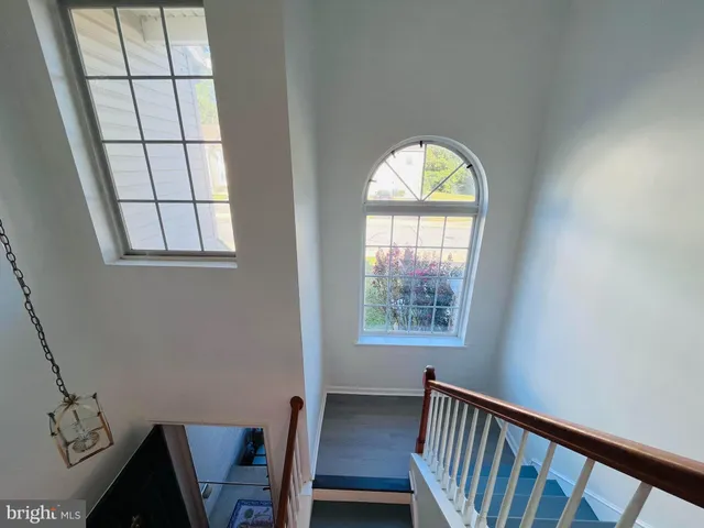 a view of entryway with wooden floor and a window