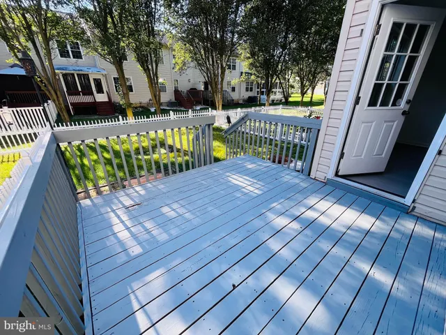 a view of balcony with wooden floor