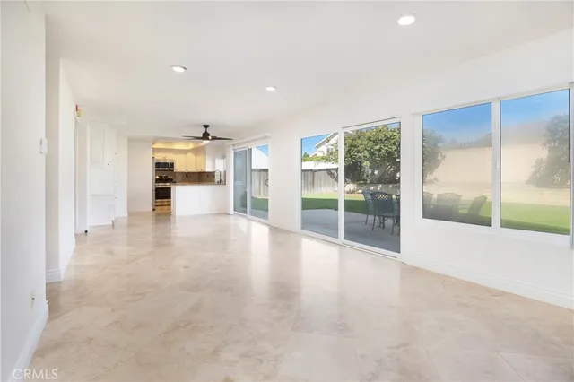 a view of empty room with floor to ceiling window