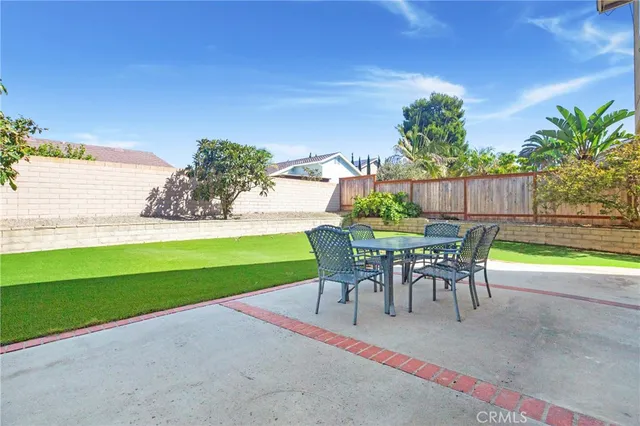 a view of a yard with furniture and a yard